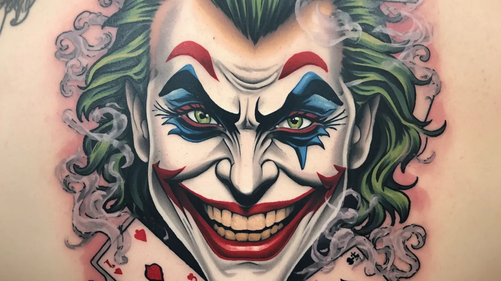 face joker tattoo